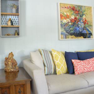 $40 to update a couch?! Instead of buying a new couch, you can easily sew a slipcover! Using drop cloths as the fabric keeps the cost down.