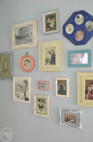 By using picture frames purchased at garage sales and thrift stores, it's easy and cheap to create a custom gallery wall!