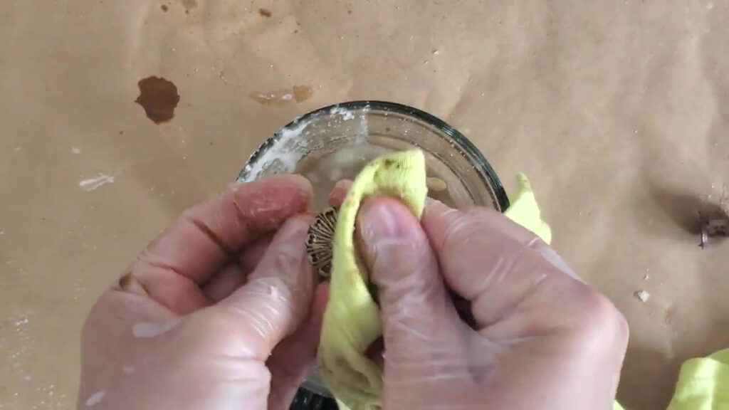 use a cotton or microfiber rag to clean brass