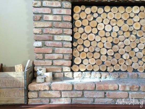 build a fireplace screen with wood slices to look like stacked logs