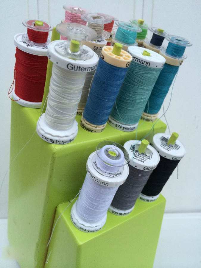 thread storage with bobbins from upcycled knife block