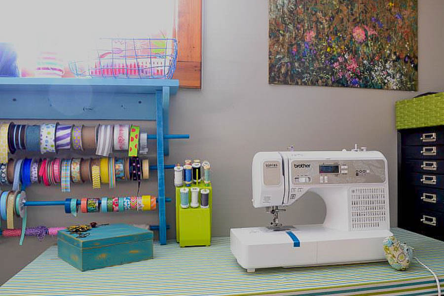 thread organizer that hold thread and bobbins for easy access next to sewing machine