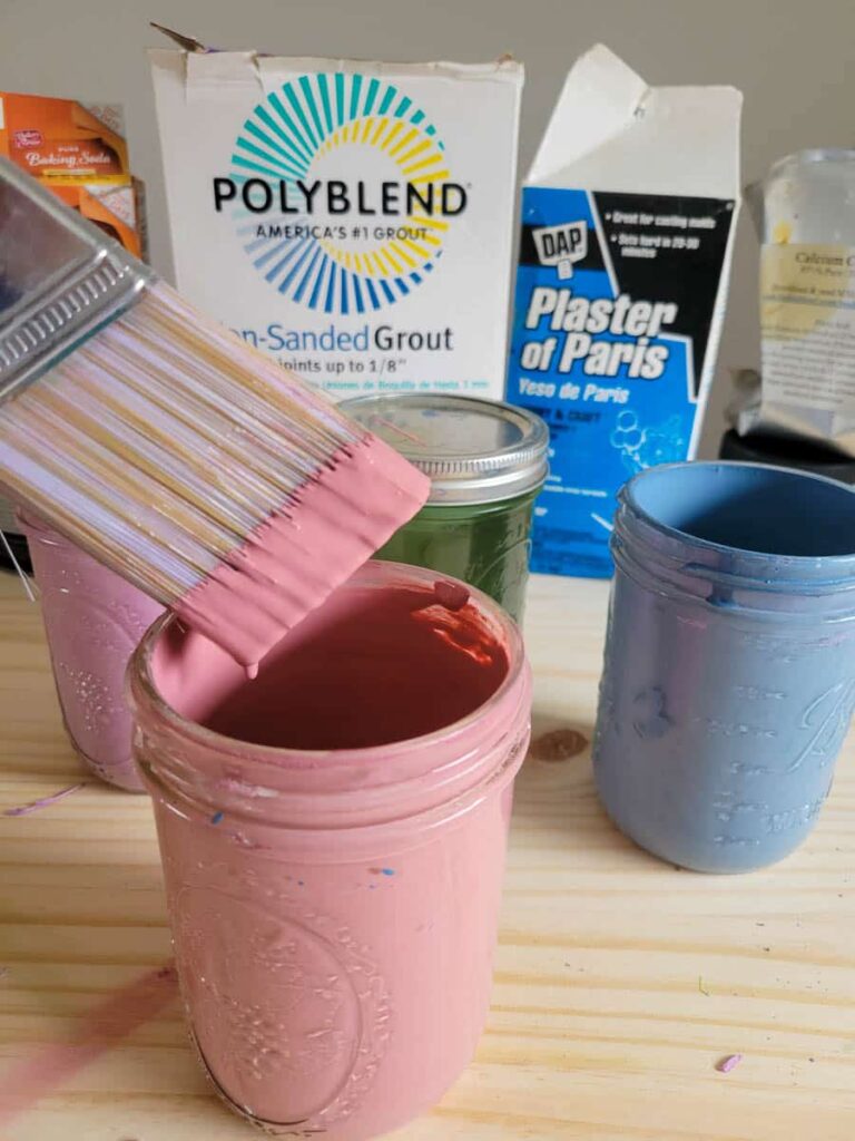 use a wide mason jar to mix up DIY chalk paint - allows for easy storage, mixing and it fits a paint brush