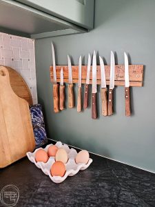 Easily make any piece of wood into a magnetic knife rack. This one was made with a vintage drafting ruler, but you could easily use barnwood or live edge wood.