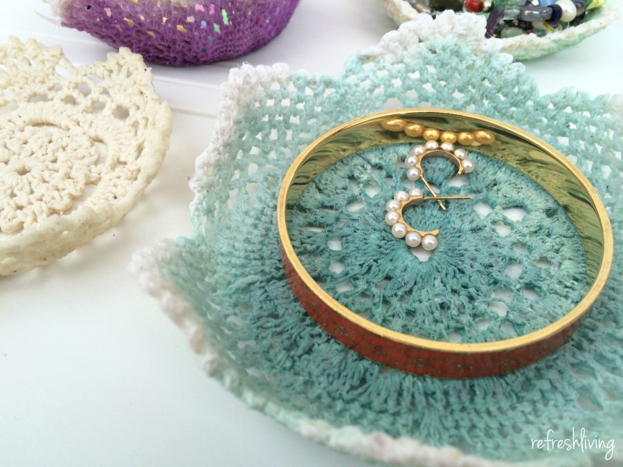 reuse vintage doilies to make small bowls for holding jewelry, hair bands or other small items