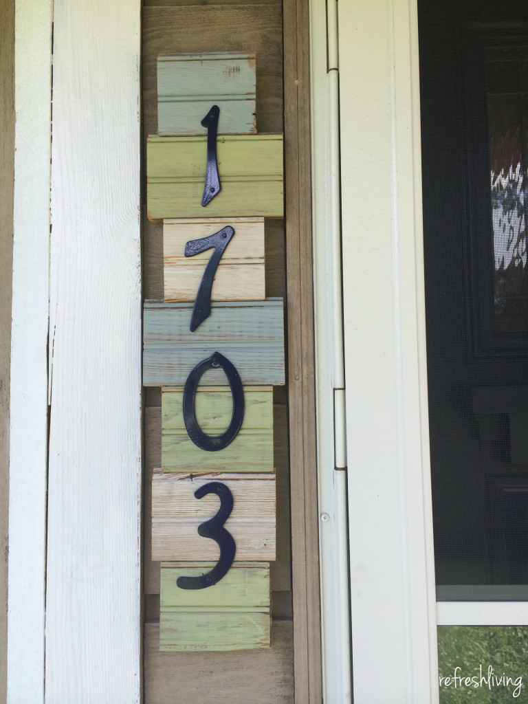 address sign using old wood of pieces of beadboard glued together