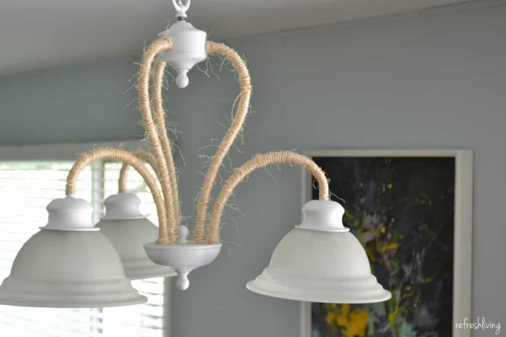 reuse an old light to make a new chandelier with rope and paint perfect for lake house or beach decor