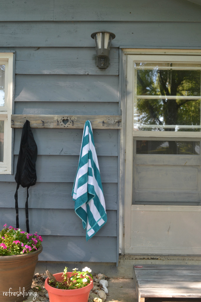 Use old wood to create a swimsuit and towel drying rack | School house vintage coat hooks on salvaged wood