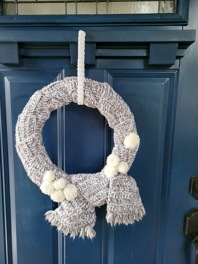 easy DIY winter wreath made from an old scarf and pom poms
