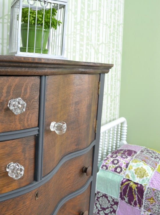 antique dresser and bed in girls room