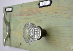 This rustic industrial towel rack is easy to make with the trick on how to attach antique glass door knobs.