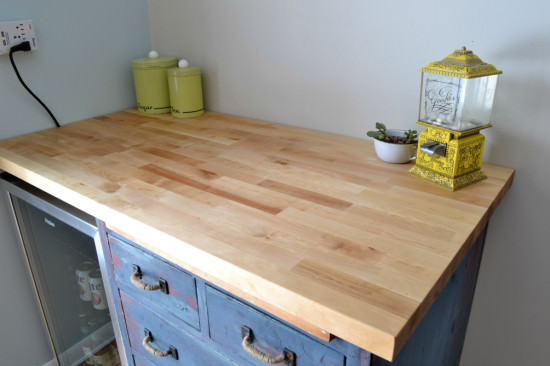 butcher block countertop with antique cabinet base