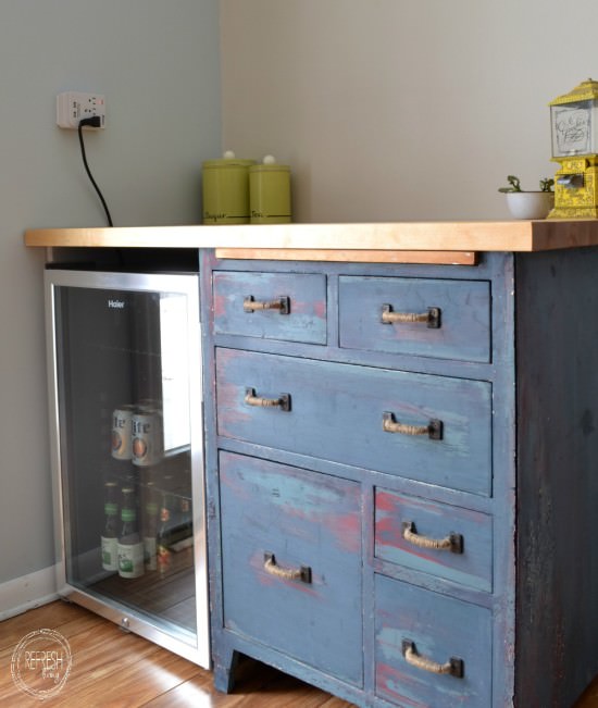 custom beverage center with mini fridge and antique dresser