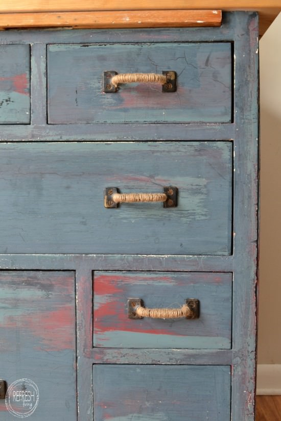 distressed dresser with 3 layers of paint