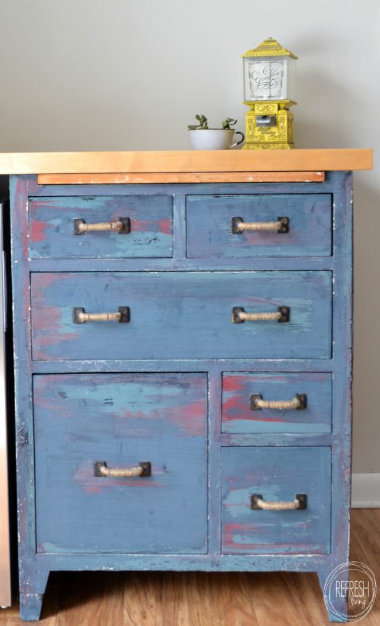 distressed furniture to show layers of paint on antique bakers cabinet repurposed with a countertop