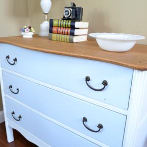 Antique dresser painted with white and turquoise with a natural wood top | two toned dresser refinish