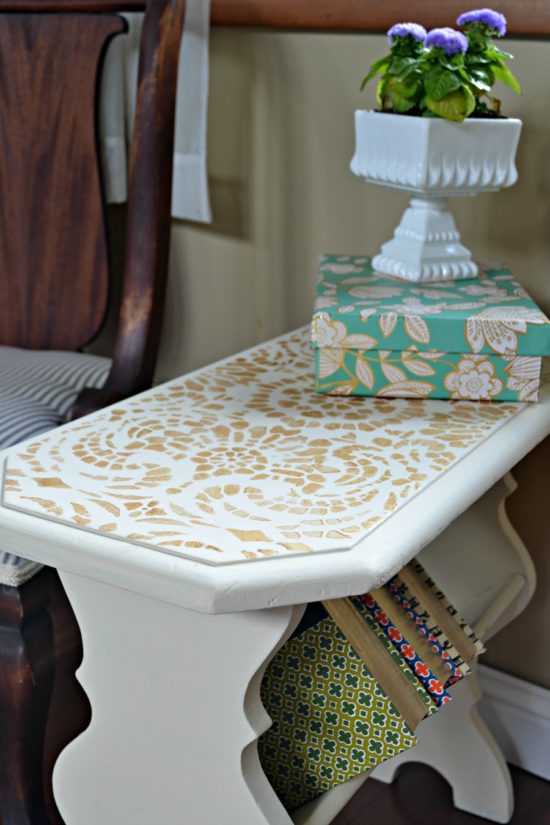 side table painted in cream with gold accents