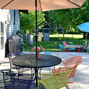 Create a backyard on a budget by painting a used patio set