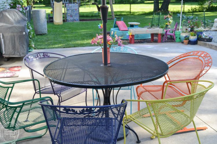 I love the multi-colored chairs! It's amazing how an old metal patio set can look new again with a coat of paint. This post also gives hints on how to cover up those rust spots!