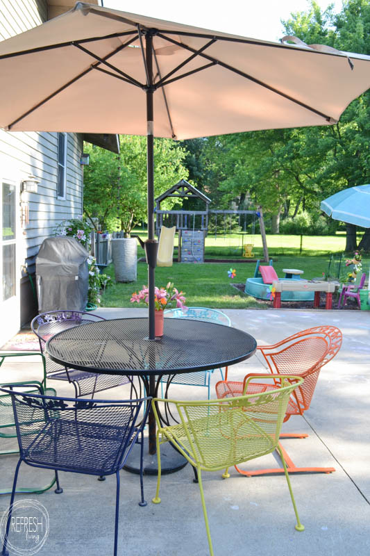 I love the multi-colored chairs! It's amazing how an old metal patio set can look new again with a coat of paint. This post also gives hints on how to cover up those rust spots!