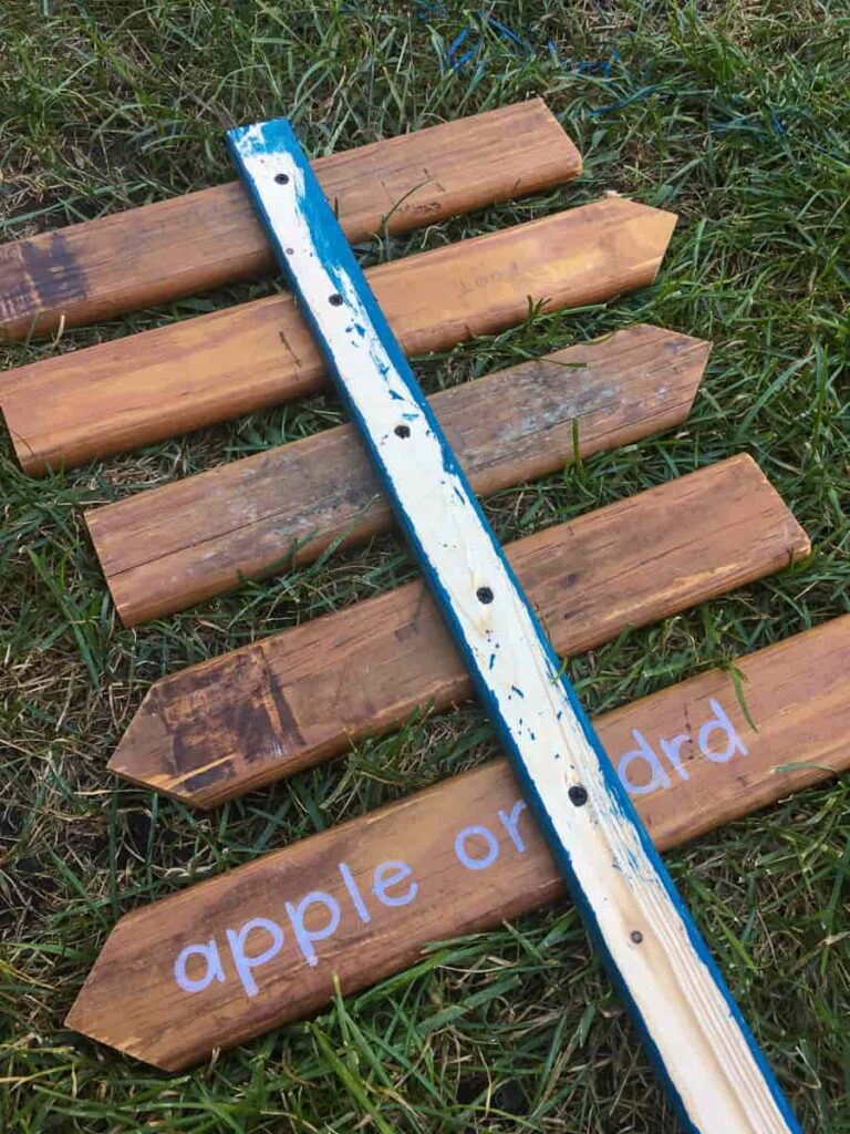 fall sign for front porch with arrows to apple orchard, pumpkin patch and corn maze