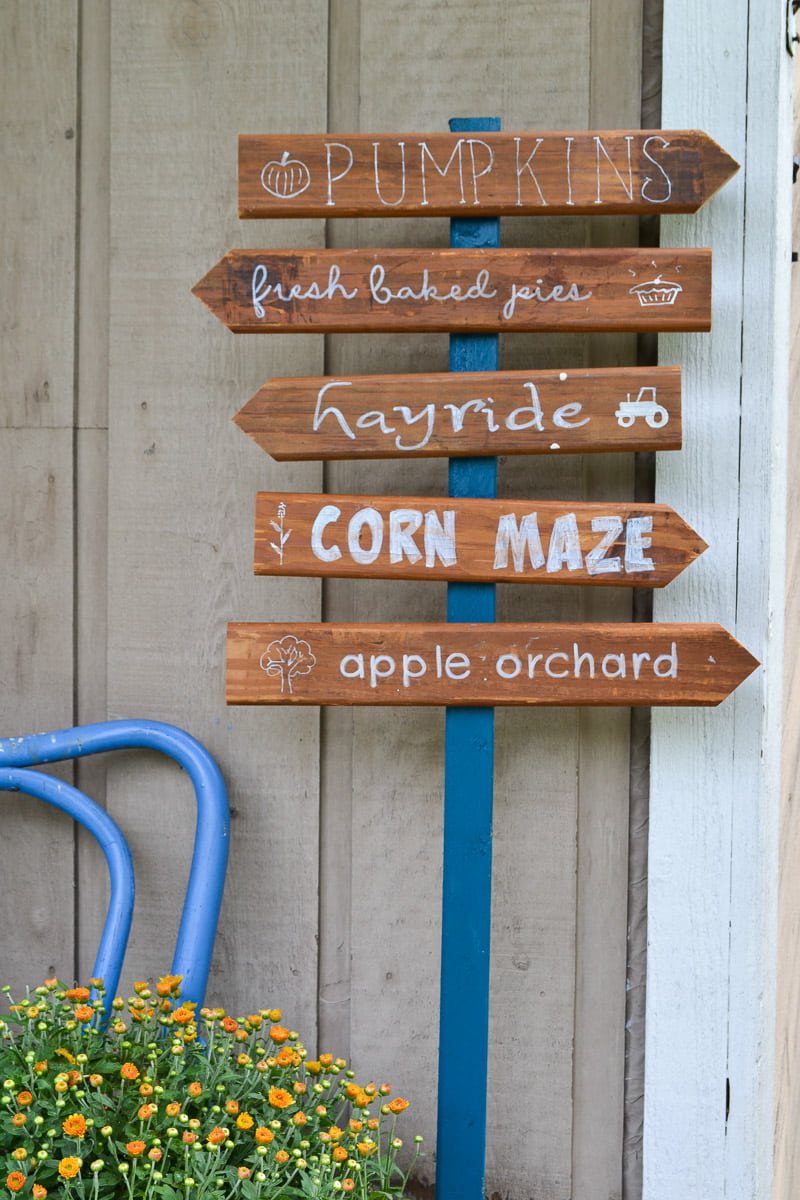 fall sign for front porch with arrows to apple orchard, pumpkin patch and corn maze