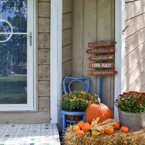By planting my own pumpkins this year, I was able to save tons of money on fall decor. Here's how I decorated our front porch for the season on a budget.