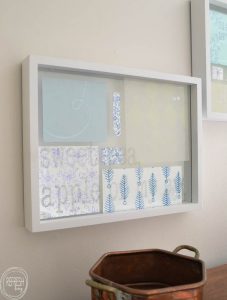 What a great way to use up that old scrapbook paper! By adding it to a floating picture frame, it acts as instant artwork. Glass etching cream can be used on the top piece of glass to custom with song lyrics or quotes.