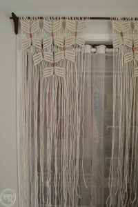 What a neat way to cover a closet opening without a door. I love the copper pipe to break up the pattern.