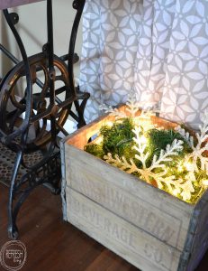 Fill an old crate with a strand of garland and lights