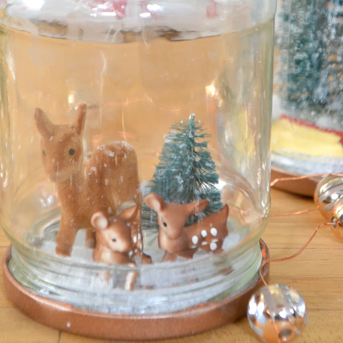 reuse glass jar for DIY Christmas decor with diy snow globes