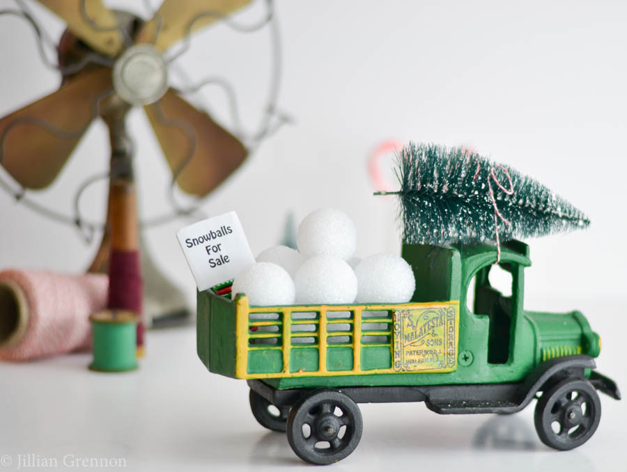 attach bottle brush tree to a vintage truck for christmas decor with vintage items