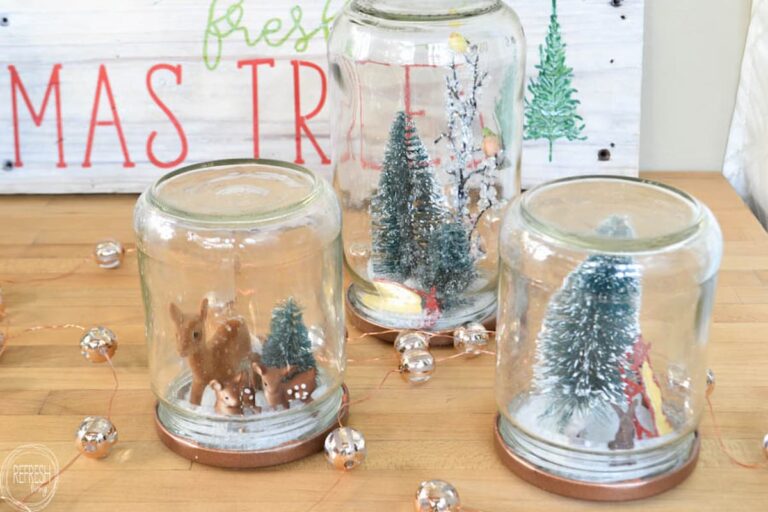three DIY snow globes reusing old glass food jars to make Christmas winter scenes - fun kids craft for Christmas