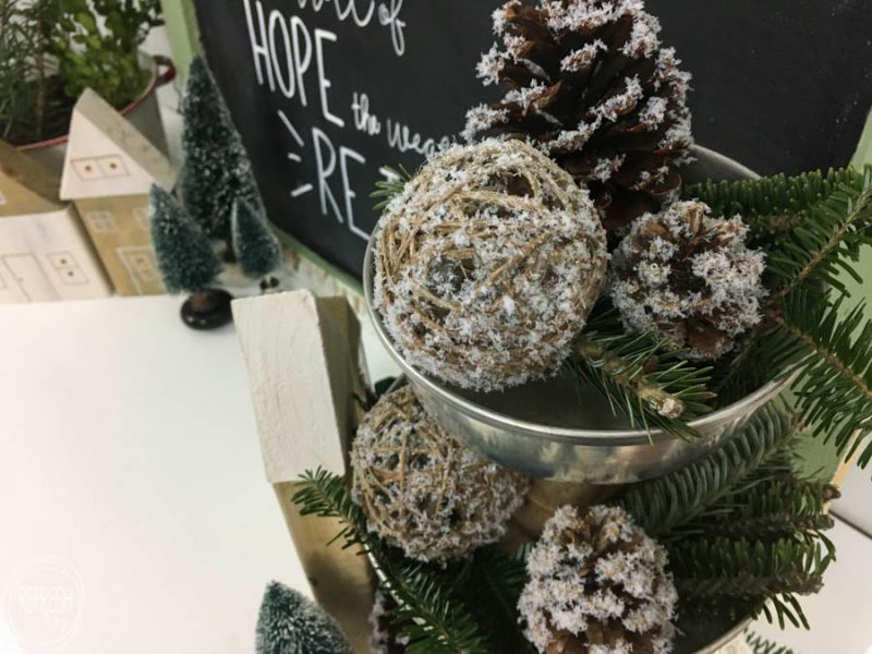 This is my kind of holiday decoration - inexpensive and easy to make! By adding fake snow to pine cones, it's easy to create natural and rustic Christmas decorations.