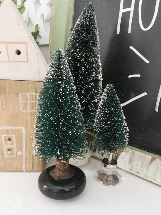 What a great way to display bottle brush trees! Instead of those ugly plastic bases, sit them in vintage door knobs or fun drawers pulls or knobs.
