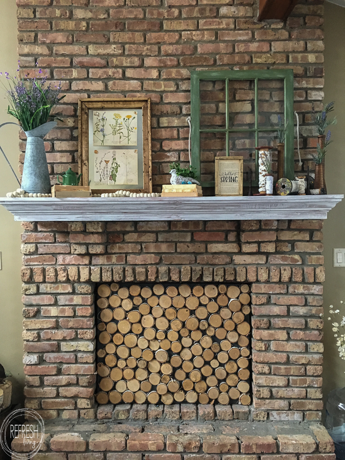 The vintage items used in this farmhouse inspired Spring mantel are perfect!