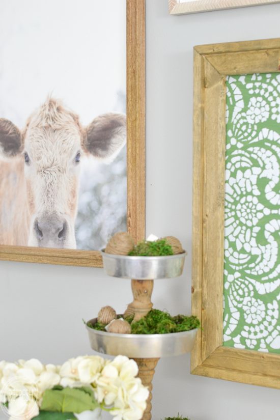 This farmhouse gallery wall has the perfect mix of neutral with a little bit of color. Since I can't have a cow of my own, I'm going to hang one on my wall!