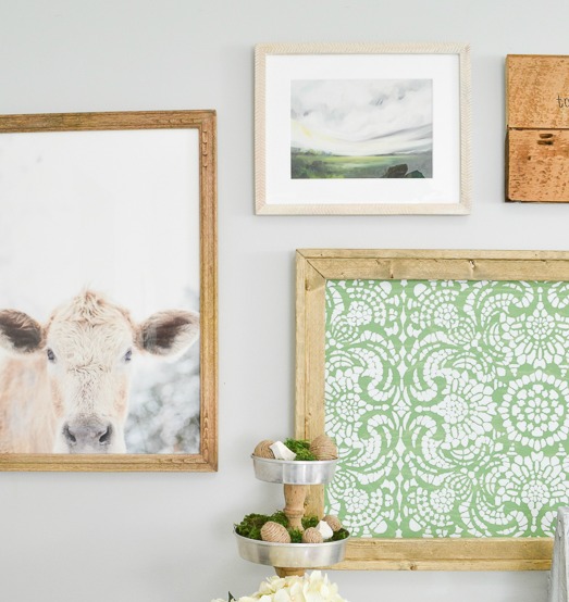 This farmhouse gallery wall has the perfect mix of neutral with a little bit of color. Since I can't have a cow of my own, I'm going to hang one on my wall!