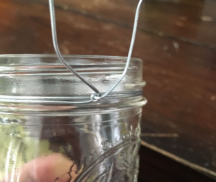 add wire around a glass jar to hang it from a sign or wall decor