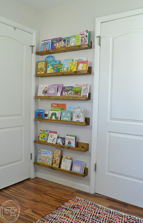 What a great use of unused space behind a door! Add book ledges to store books or small toys.