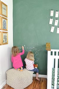 This nursery is filled with fun vintage finds to create a modern spin on a vintage classroom. I love the green chalkboard wall!