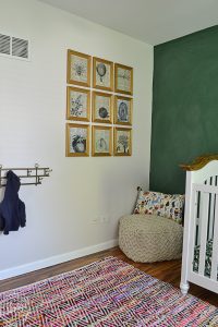 Large art display with individual frames with dictionary page art and printed vintage illustrations.