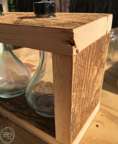 What an easy project using old glass jars and reclaimed wood. I love the combination of the barn wood with the glass! Includes a full tutorial.