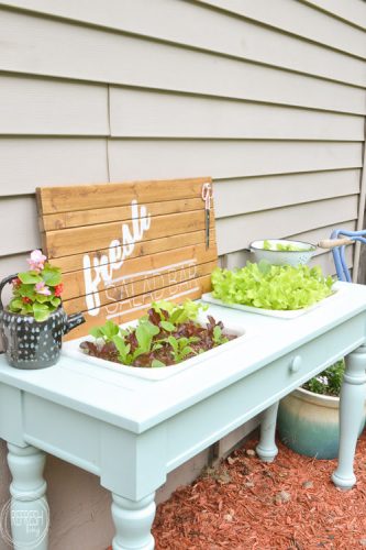 An old sofa table can be reused as a DIY raised garden bed! This is such an easy outdoor project!