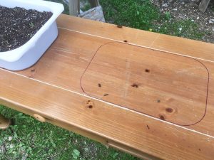 An old sofa table can be reused as a DIY raised garden bed! This is such an easy outdoor project!