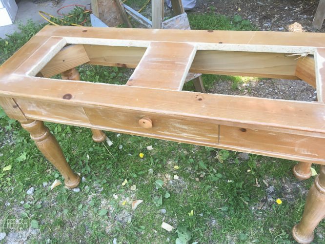 An old sofa table can be reused as a DIY raised garden bed! This is such an easy outdoor project!