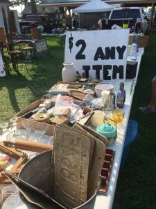 flea market booth with clearance table to get the best deals