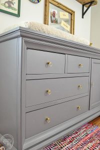 I love the gray dresser with the brass pulls. This dresser started as a dark cherry wood color; it looks so much better now.