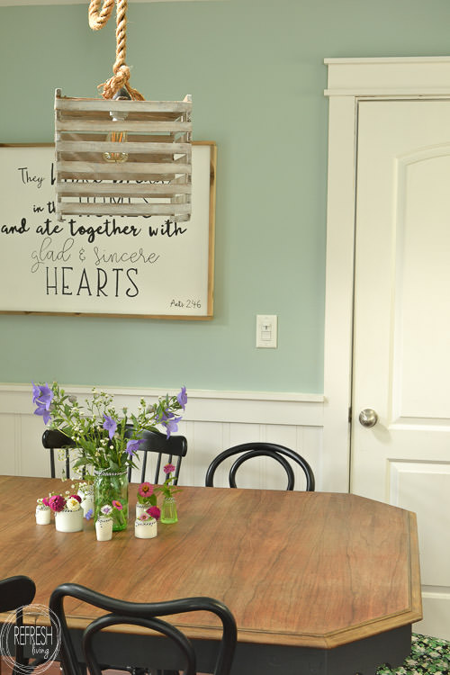 Room makeover completed for under $100 - including a new table and chairs! Vintage modern farmhouse dining room with plate gallery wall and DIY wood sign with quote.