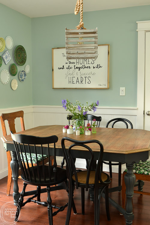 Room makeover completed for under $100 - including a new table and chairs! Vintage modern farmhouse dining room with plate gallery wall and DIY wood sign with quote.